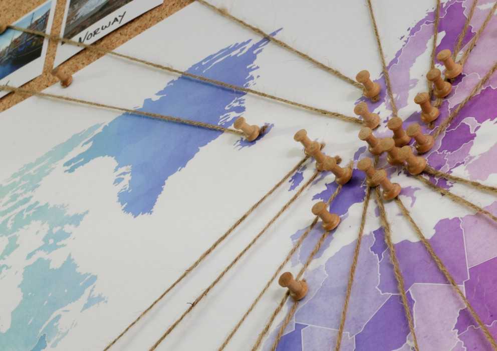 Marking your holiday destinations on the world map with pins Marking your holiday destinations on the world map with pins